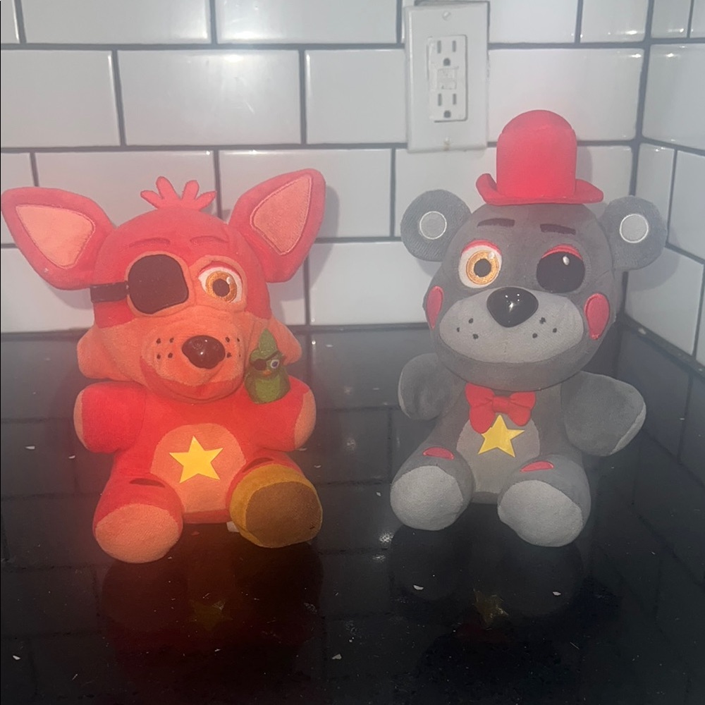 Red and Gray Plush Toy Set